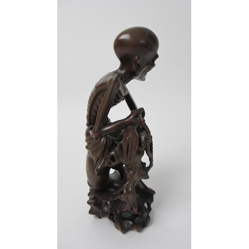 268 - A Chinese carved wood figure of a Senin