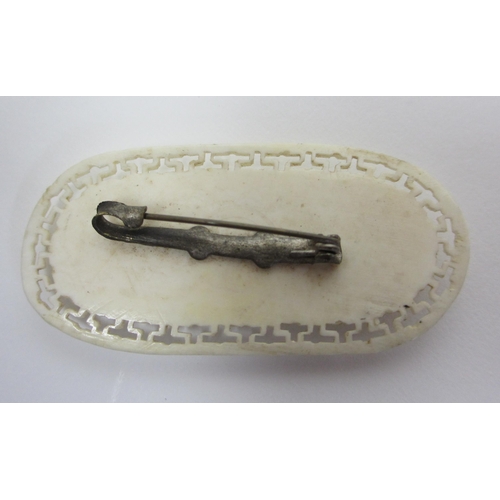 269 - A Japanese carved ivory brooch