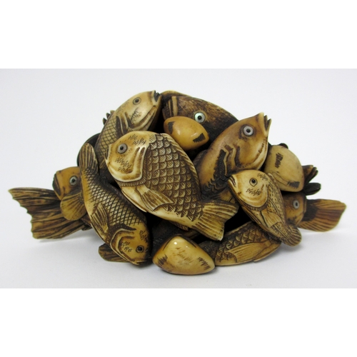 271 - A Japanese carved ivory model of numerous fish and scallops