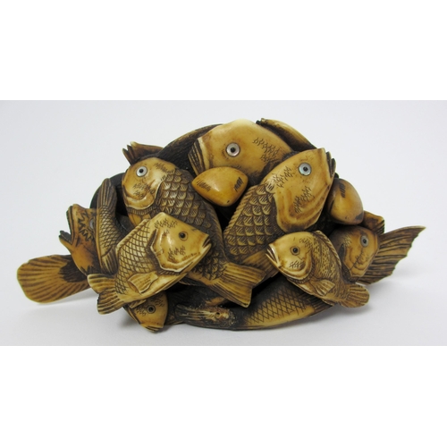 271 - A Japanese carved ivory model of numerous fish and scallops