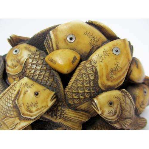 271 - A Japanese carved ivory model of numerous fish and scallops