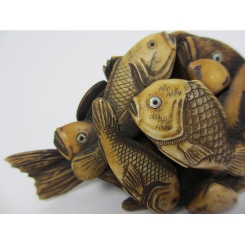 271 - A Japanese carved ivory model of numerous fish and scallops