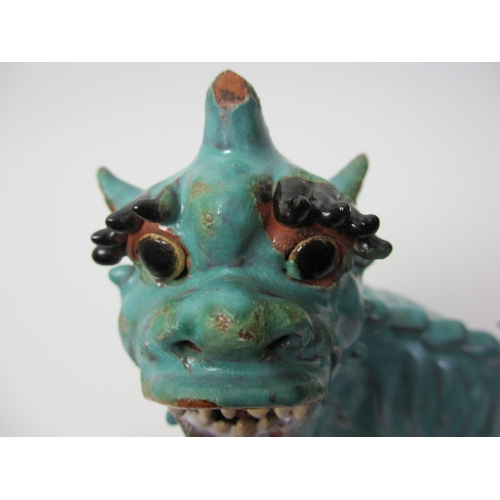 276 - A Chinese turquoise glazed pottery dog of fo