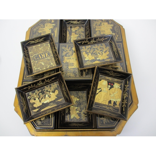 278 - A Chinese export black and gold lacquered octagonal shaped games box