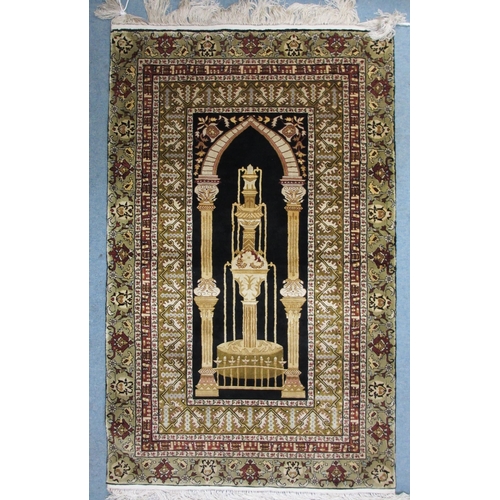 313 - A silk embroidered rug