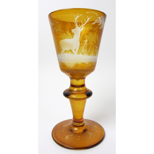 483 - A pair of Bohemian amber and engraved glass covered vases