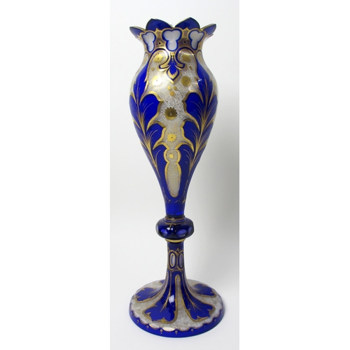 484 - A Bohemian blue overlaid and gilt opaque glass vase