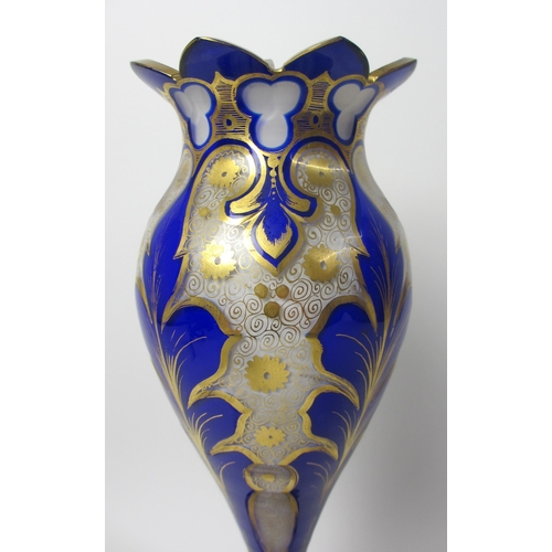 484 - A Bohemian blue overlaid and gilt opaque glass vase