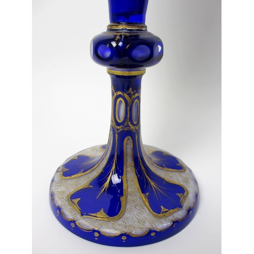 484 - A Bohemian blue overlaid and gilt opaque glass vase