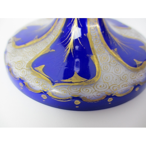 484 - A Bohemian blue overlaid and gilt opaque glass vase