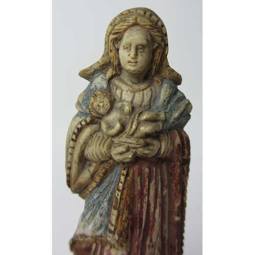 510 - A painted ivory figure of the Madonna and Child