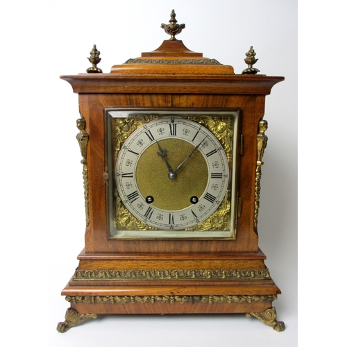 514 - A German walnut cased mantel clock