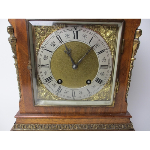 514 - A German walnut cased mantel clock