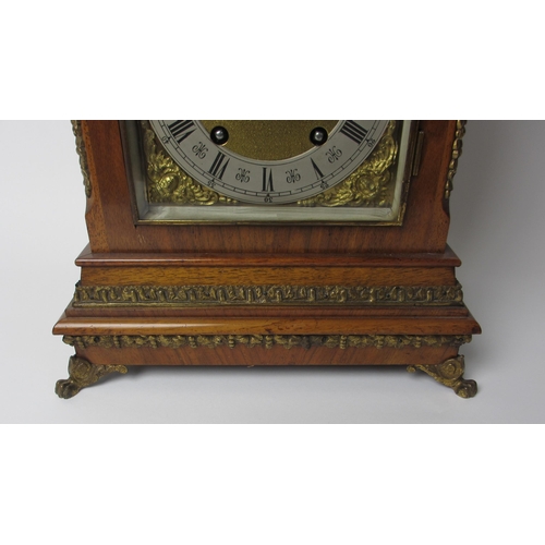 514 - A German walnut cased mantel clock