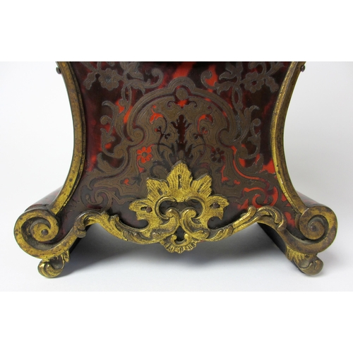 515 - A French boulle style rococo scroll shaped mantel clock