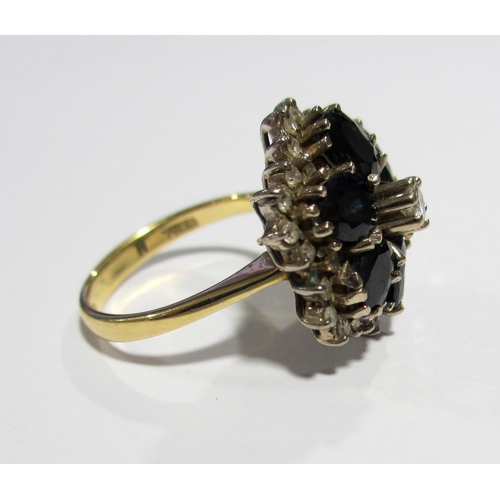 52 - A sapphire and diamond circular flowerhead cluster ring