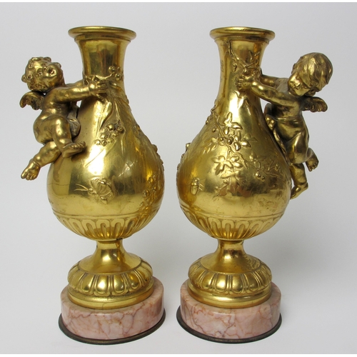 523 - A pair of gilt metal vases modelled after August Moreau