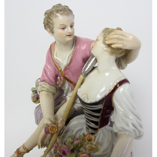 554 - A Meissen group of a courting couple