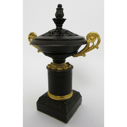 559 - A bronze and gilt metal two handled incense burner and cover