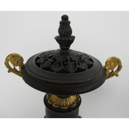 559 - A bronze and gilt metal two handled incense burner and cover