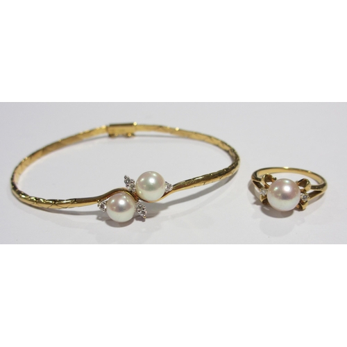 60 - An 18ct gold cultured pearl and diamond bracelet and ring