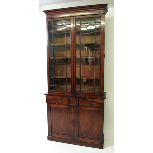 606 - A William IV mahogany bookcase on chiffonier base