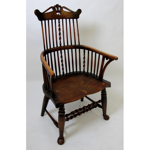 626 - A 19th century Windsor ash armchair