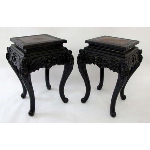 631 - A pair of Chinese carved hardwood plant stands / tables