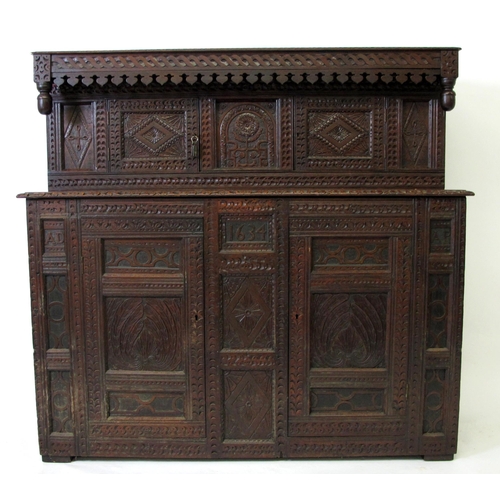 637 - A mid 17th century style carved oak court cupboard