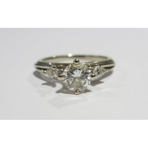 67 - A contemporary design solitaire diamond ring