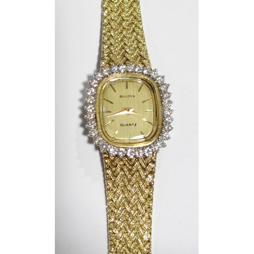 70 - A ladies 14kt gold diamond wrist watch by Bulova