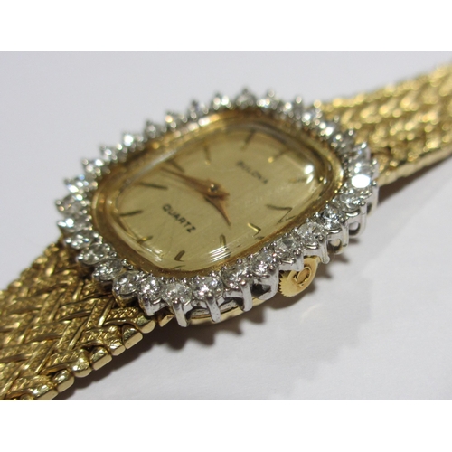 70 - A ladies 14kt gold diamond wrist watch by Bulova