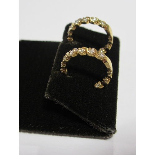 71 - A pair of diamond hoop earrings