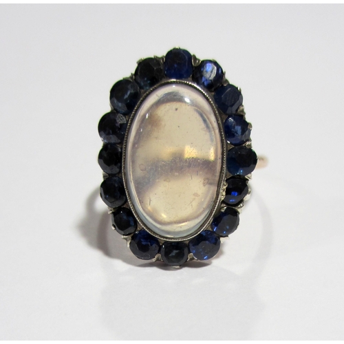 77 - An attractive Edwardian moonstone and sapphire ring