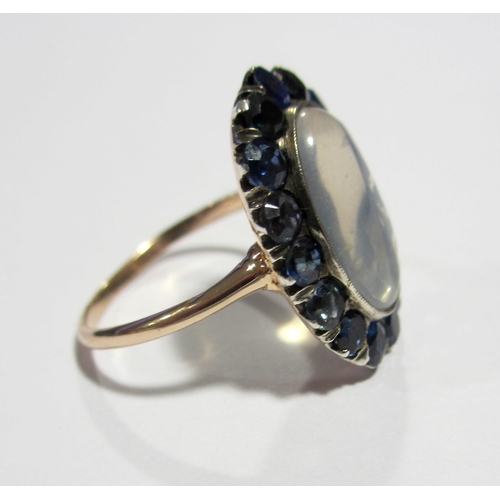 77 - An attractive Edwardian moonstone and sapphire ring