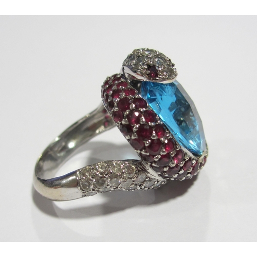 78 - A diamond topaz and ruby cocktail ring