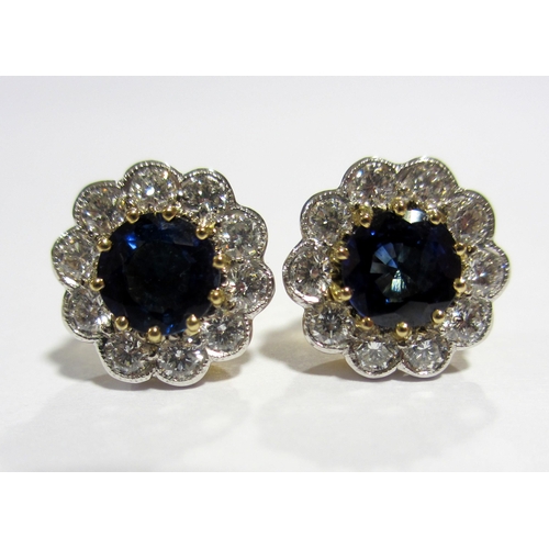 84 - An attractive pair of sapphire and diamond stud earrings