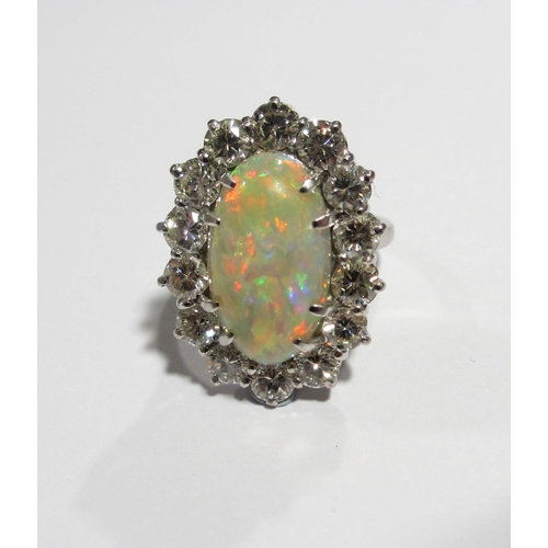 86 - An impressive opal and diamond cluster ring