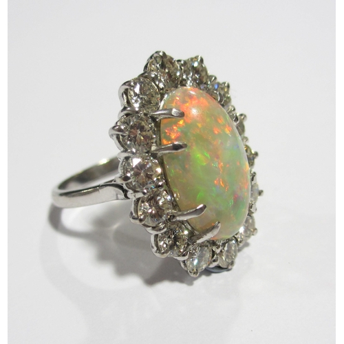 86 - An impressive opal and diamond cluster ring