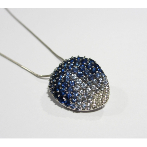 87 - A contemporary design sapphire and diamond pendant brooch