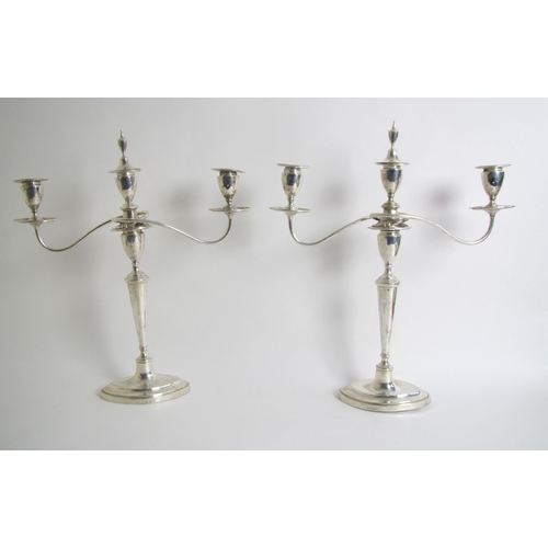 190 - A pair of silver three branch candelabra