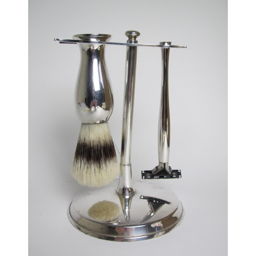 199 - A modern silver shaving set on stand