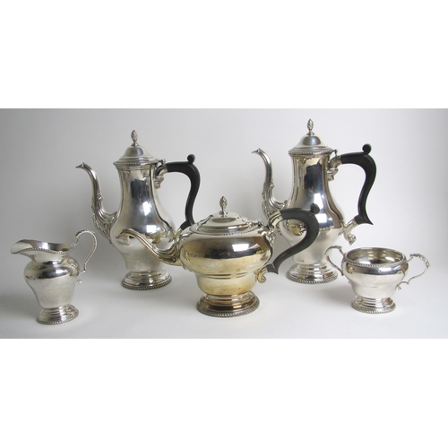 204 - A four piece silver tea service with matched coffee pot