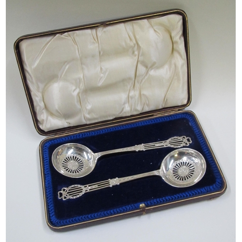 220A - A cased pair of silver sifter spoons