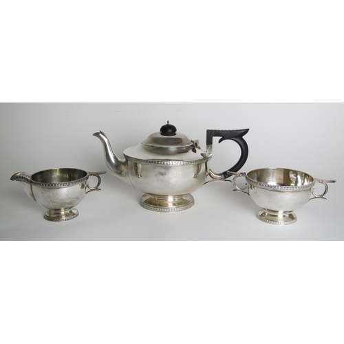 221 - A three piece silver tea service  by Walker & Hall