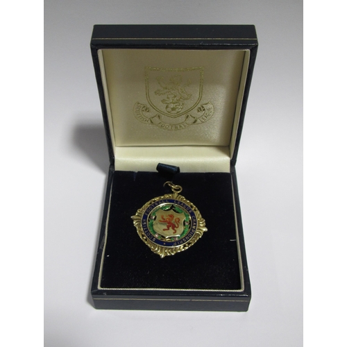 243 - Of Celtic F.C interest A Scottish League Championship nine carat gold and enamel medal