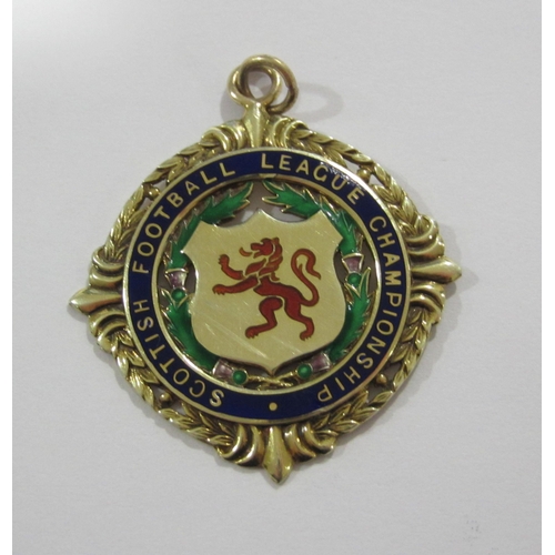 243 - Of Celtic F.C interest A Scottish League Championship nine carat gold and enamel medal