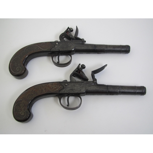 293 - A pair of flintlock pistols  by John Joyner  London