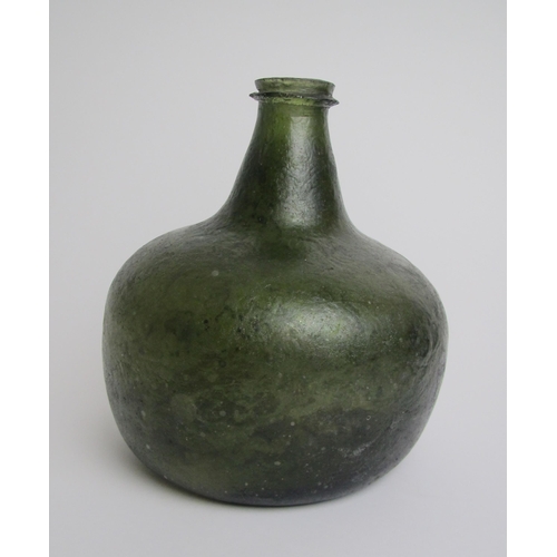 517 - An 18th Century green glass wine bottle