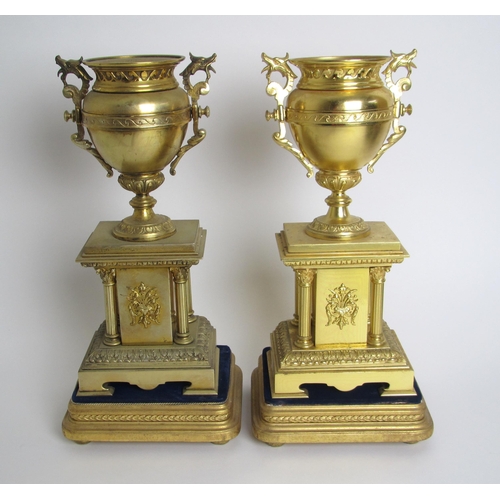 520 - A pair of Victorian brass side urns on pillar bases